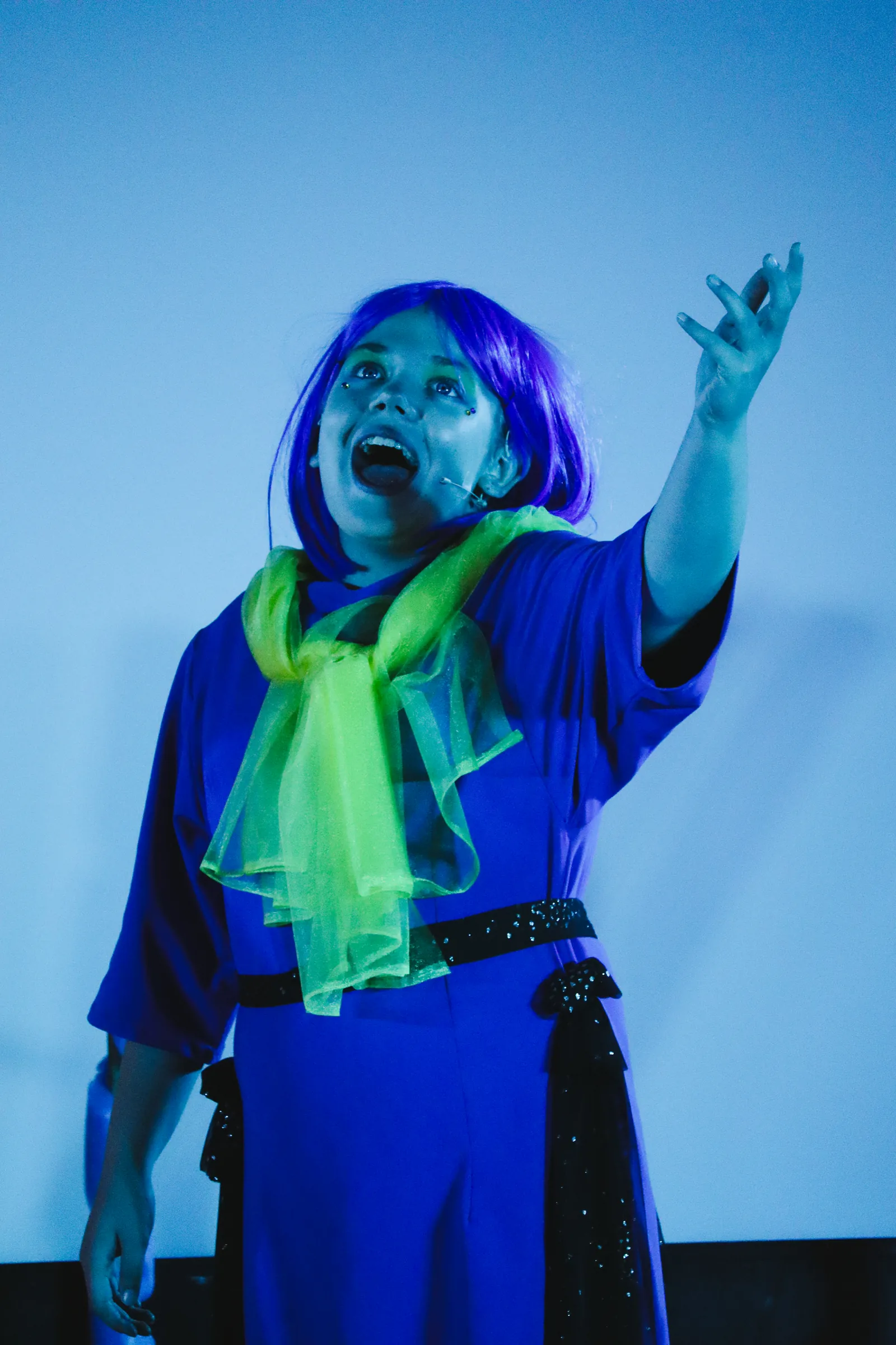 A CBY Academy student performing in costume on stage
