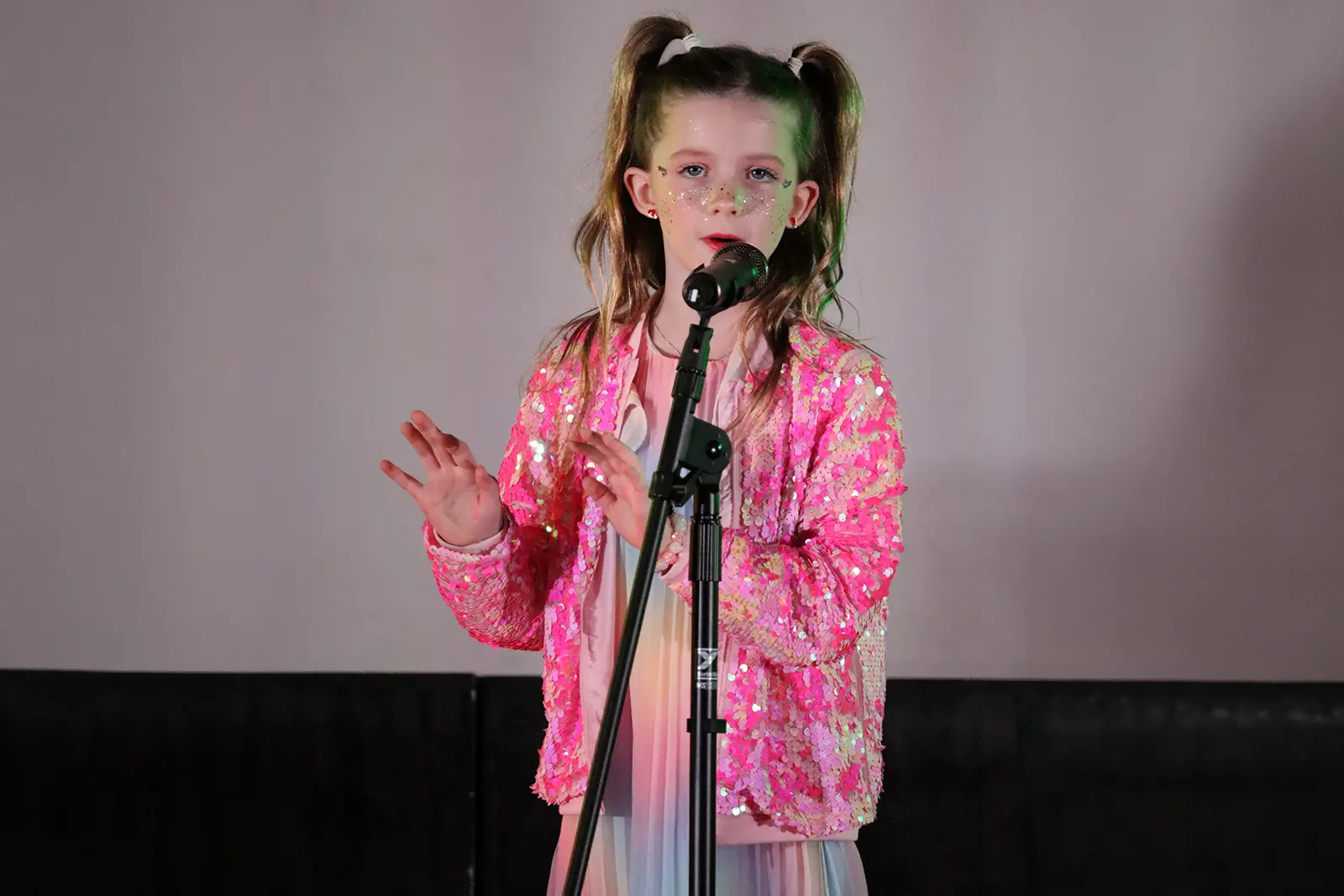 CBY Academy students performing together on stage